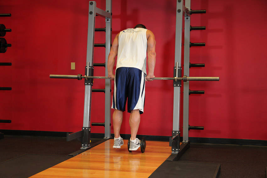 Calf Raise On A Dumbbell - starting position