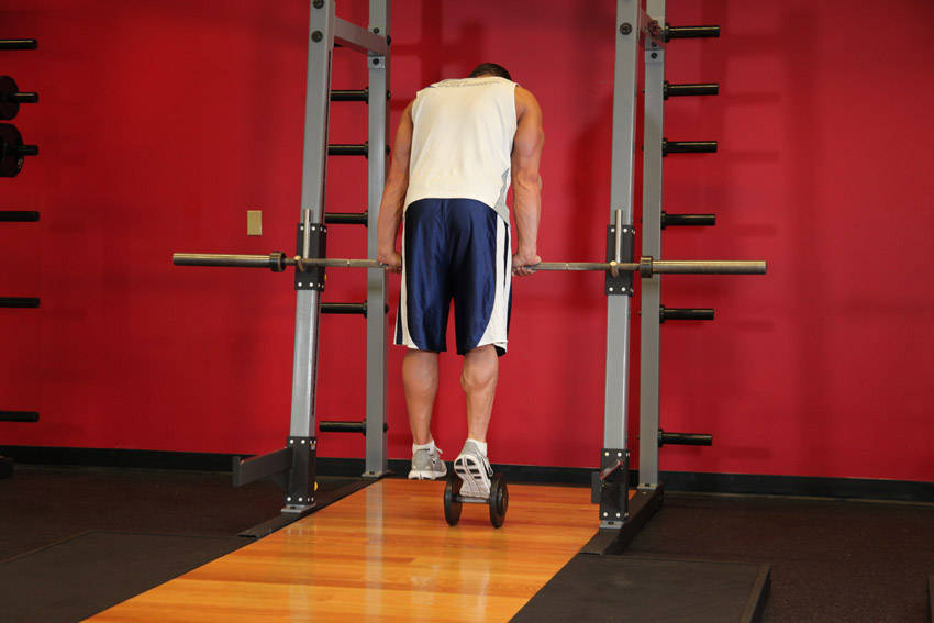 Calf Raise On A Dumbbell - ending position