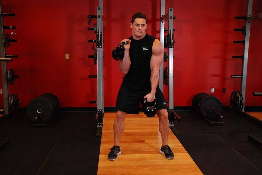 Double Kettlebell Alternating Hang Clean - ending position