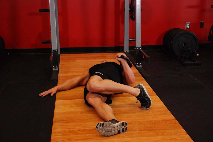 Extended Range One-Arm Kettlebell Floor Press - starting position