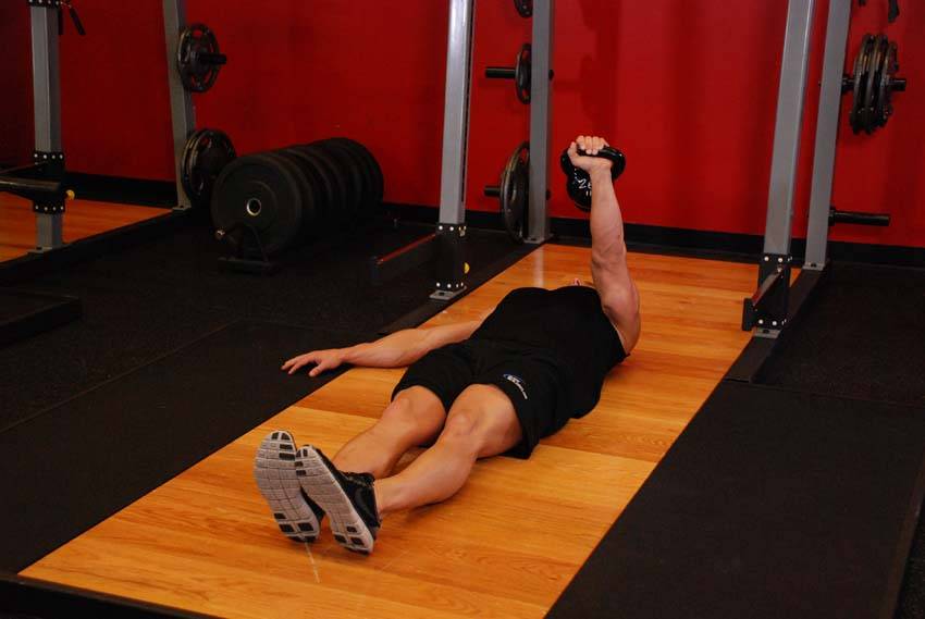 One-Arm Kettlebell Floor Press - ending position