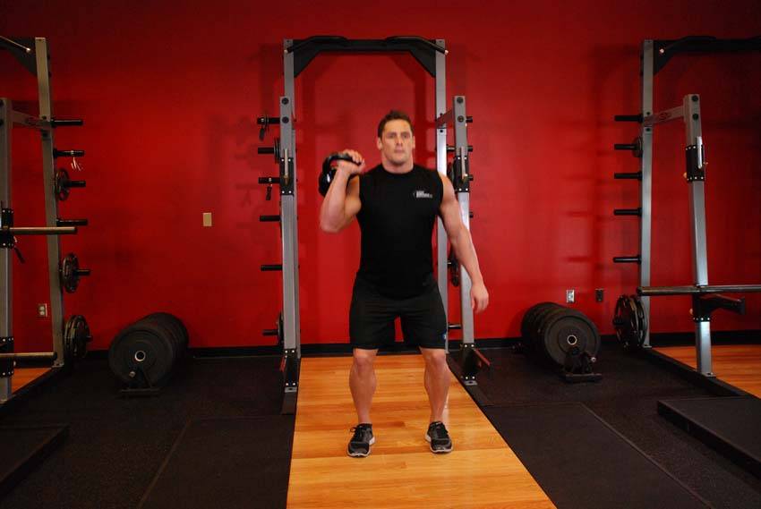 One-Arm Kettlebell Split Jerk - ending position