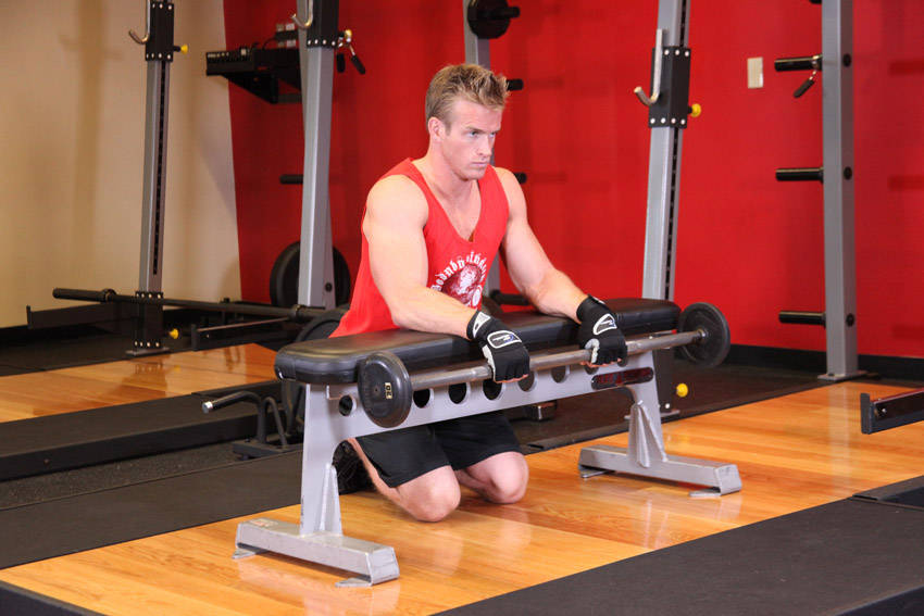 Palms-Down Wrist Curl Over A Bench - starting position