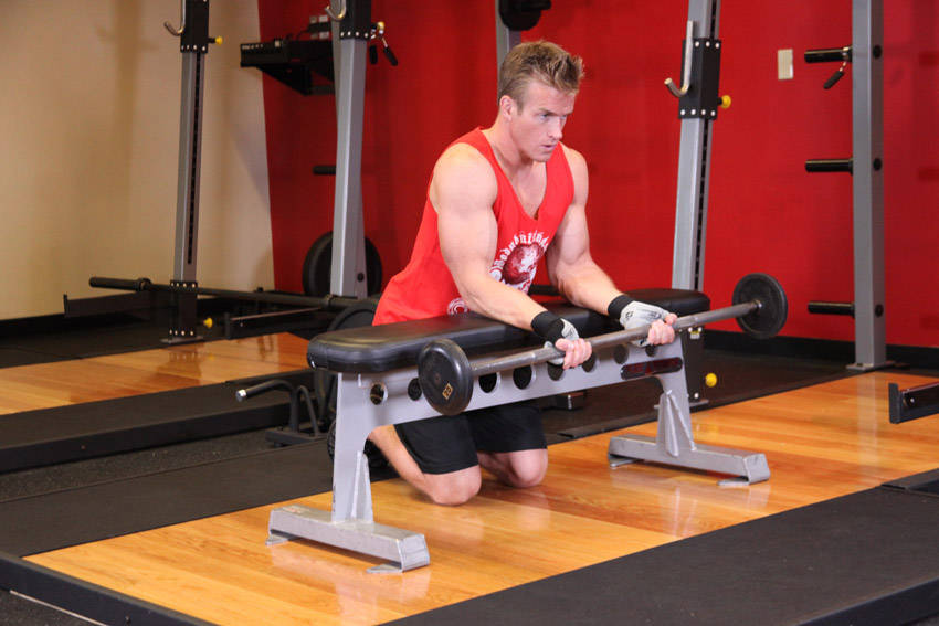 Palms-Up Barbell Wrist Curl Over A Bench - starting position