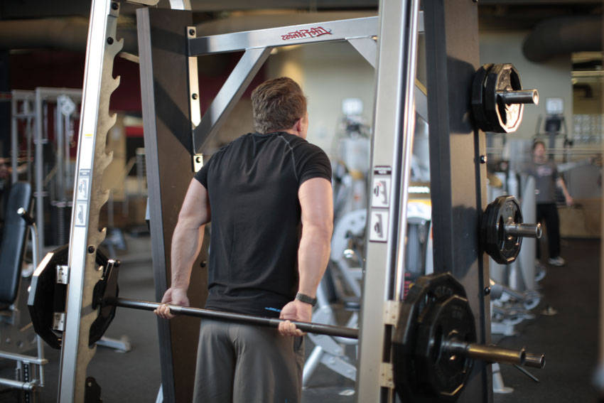 Smith Machine Behind the Back Shrug - ending position