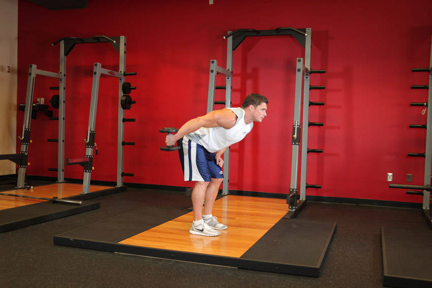 Standing Bent-Over One-Arm Dumbbell Triceps Extension - ending position
