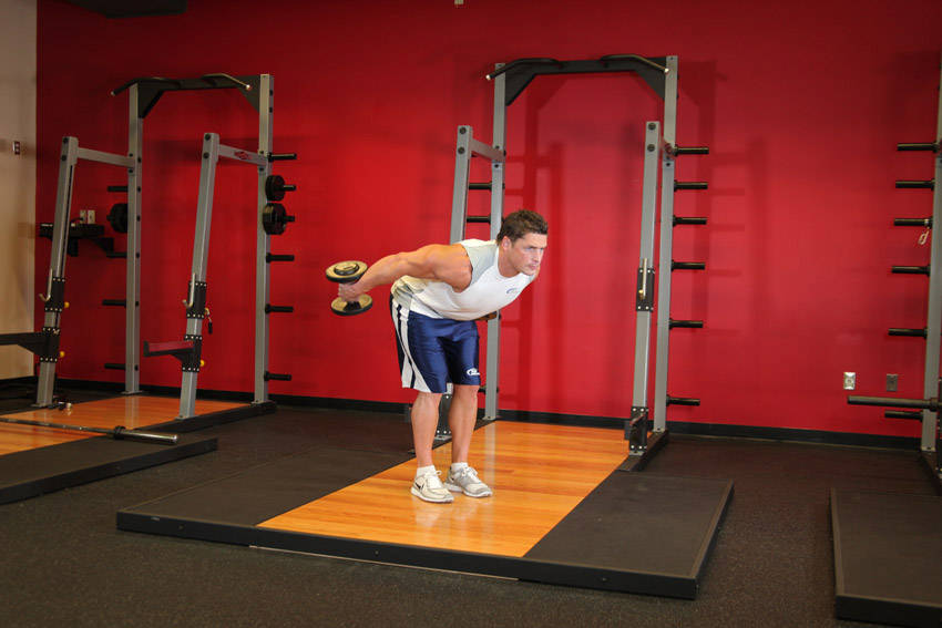 Standing Bent-Over Two-Arm Dumbbell Triceps Extension - ending position