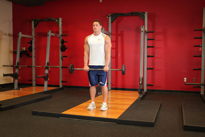Standing Front Barbell Raise Over Head - starting position
