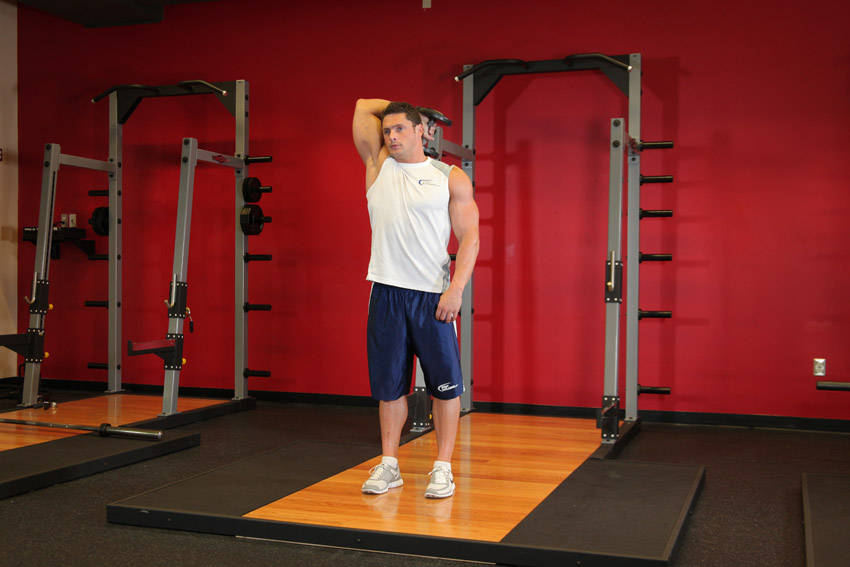 Standing One-Arm Dumbbell Triceps Extension - ending position