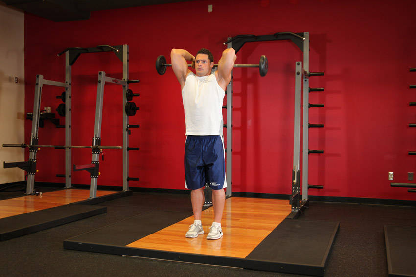 Standing Overhead Barbell Triceps Extension - starting position