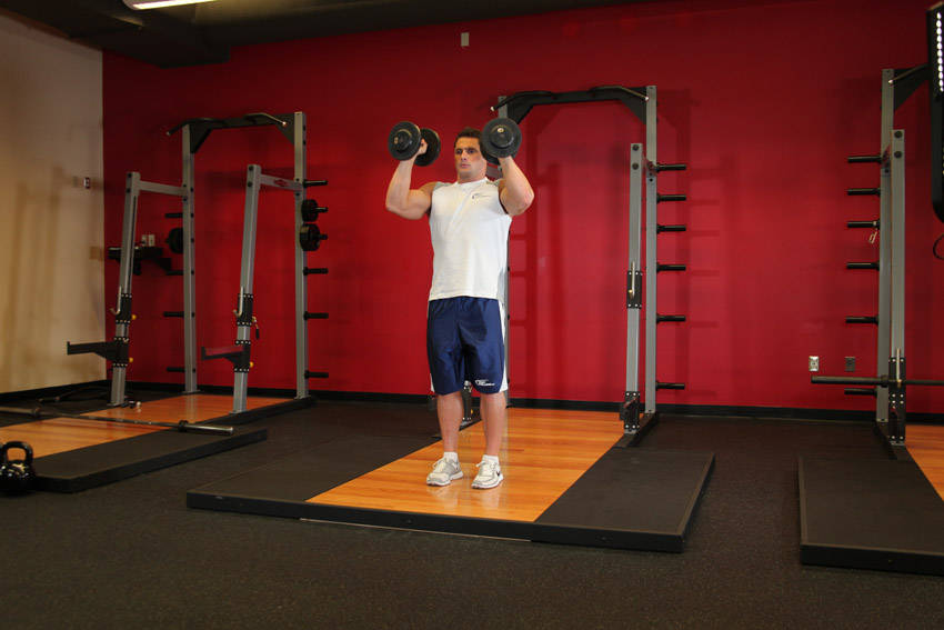 Standing Palms-In Dumbbell Press - ending position