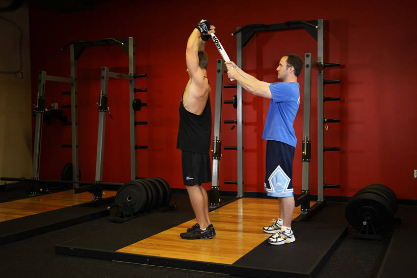 Standing Towel Triceps Extension - ending position