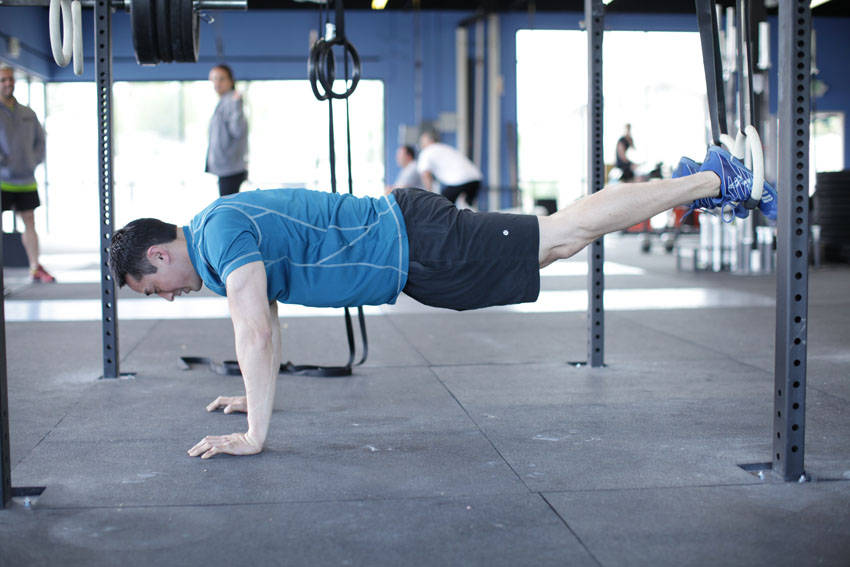Suspended Reverse Crunch - starting position