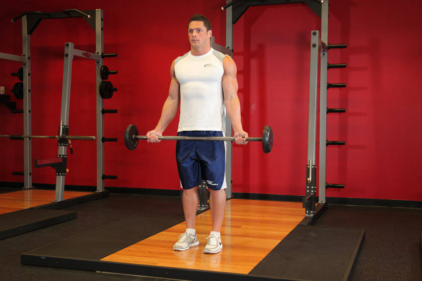 Wide-Grip Standing Barbell Curl - starting position